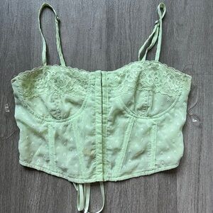 small pacsun light green corset top with adjustable straps, metal clips, and bow